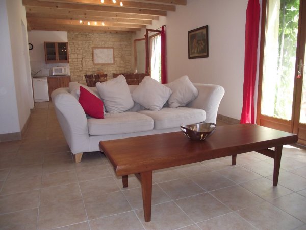 Lounge/diner area at Les Hiboux gites, France